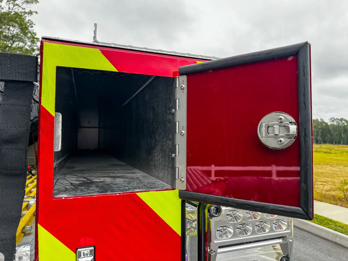 Rear corner panel close-up with taillight cluster and chevron striping.
